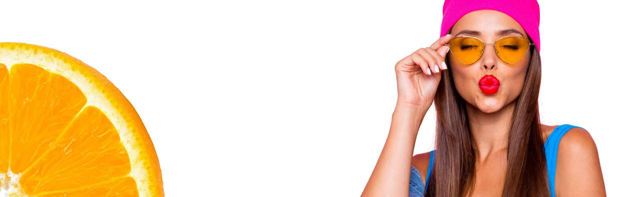 Woman wearing sunglasses and a pink headband with a sliced orange on a white background