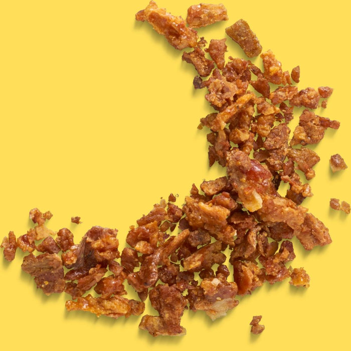 Dried fruits or nuts on a yellow background representing propolis extract