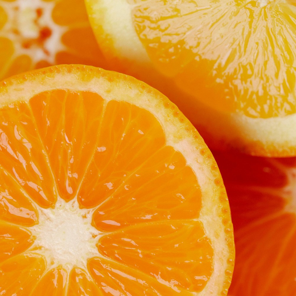 Close-up of sliced oranges with a vibrant color representing Vitamin C