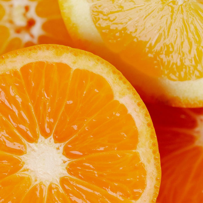 Close-up of sliced oranges with a vibrant color representing Vitamin C